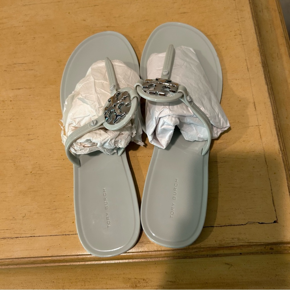 Tory Burch mini miller jelly thong women’s sandal in a gray/ light blue color 9m